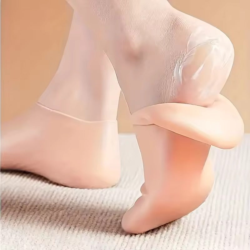 Close-up of a peach silicone foot-care sock being pulled away from the heel