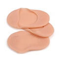 Pair of beige perforated silicone gel foot-care covers on a white background