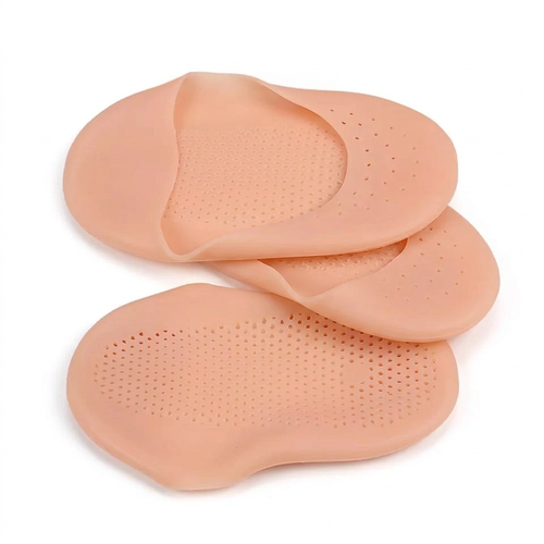 Pair of beige perforated silicone gel foot-care covers on a white background