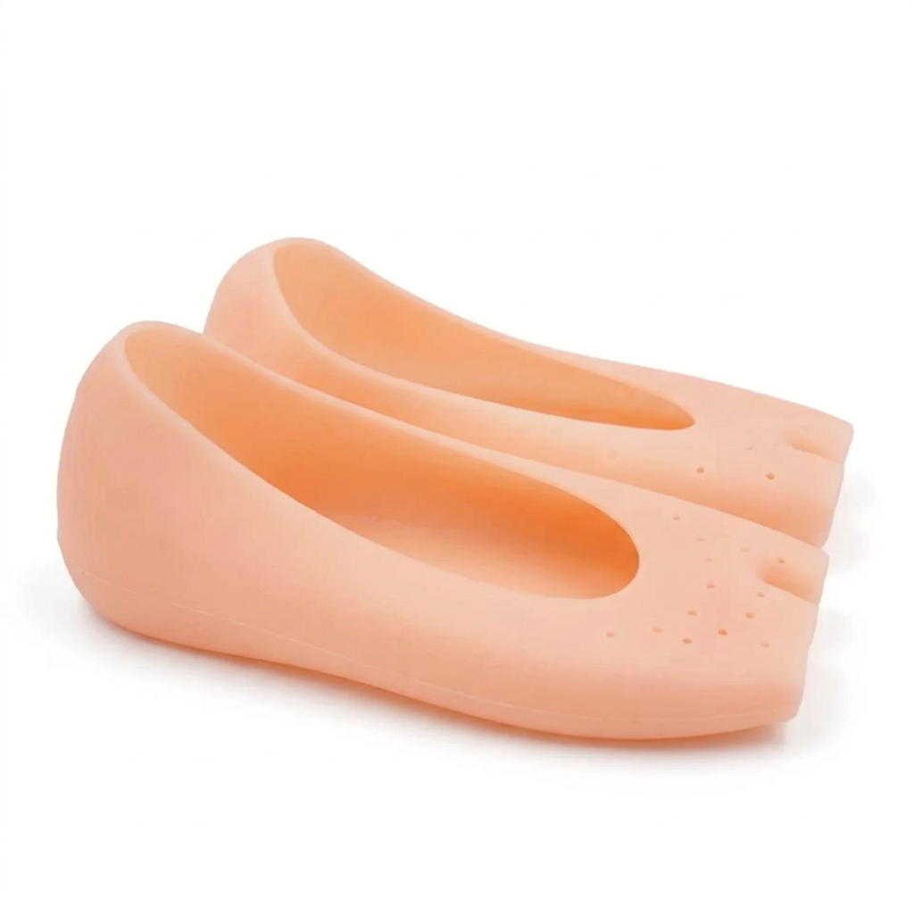 Side view of peach open-toe silicone foot covers showing the low-cut heel profile