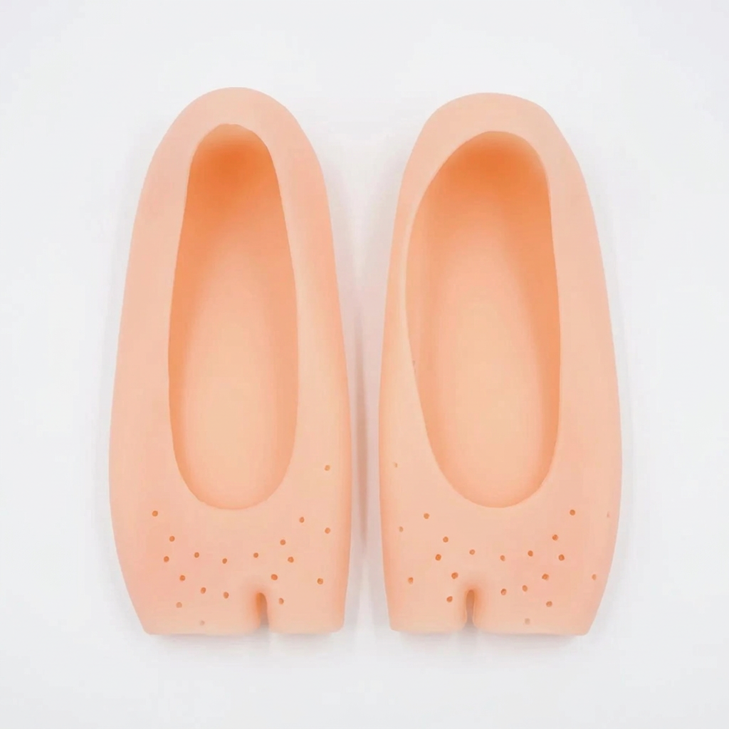 Top view of peach silicone foot covers showing the upper openings and perforated forefoot
