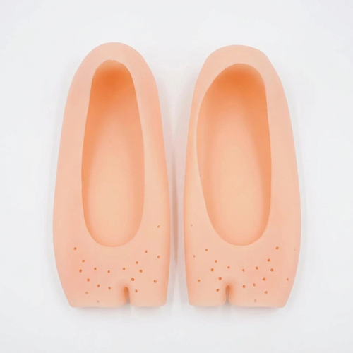 Top view of peach silicone foot covers showing the upper openings and perforated forefoot